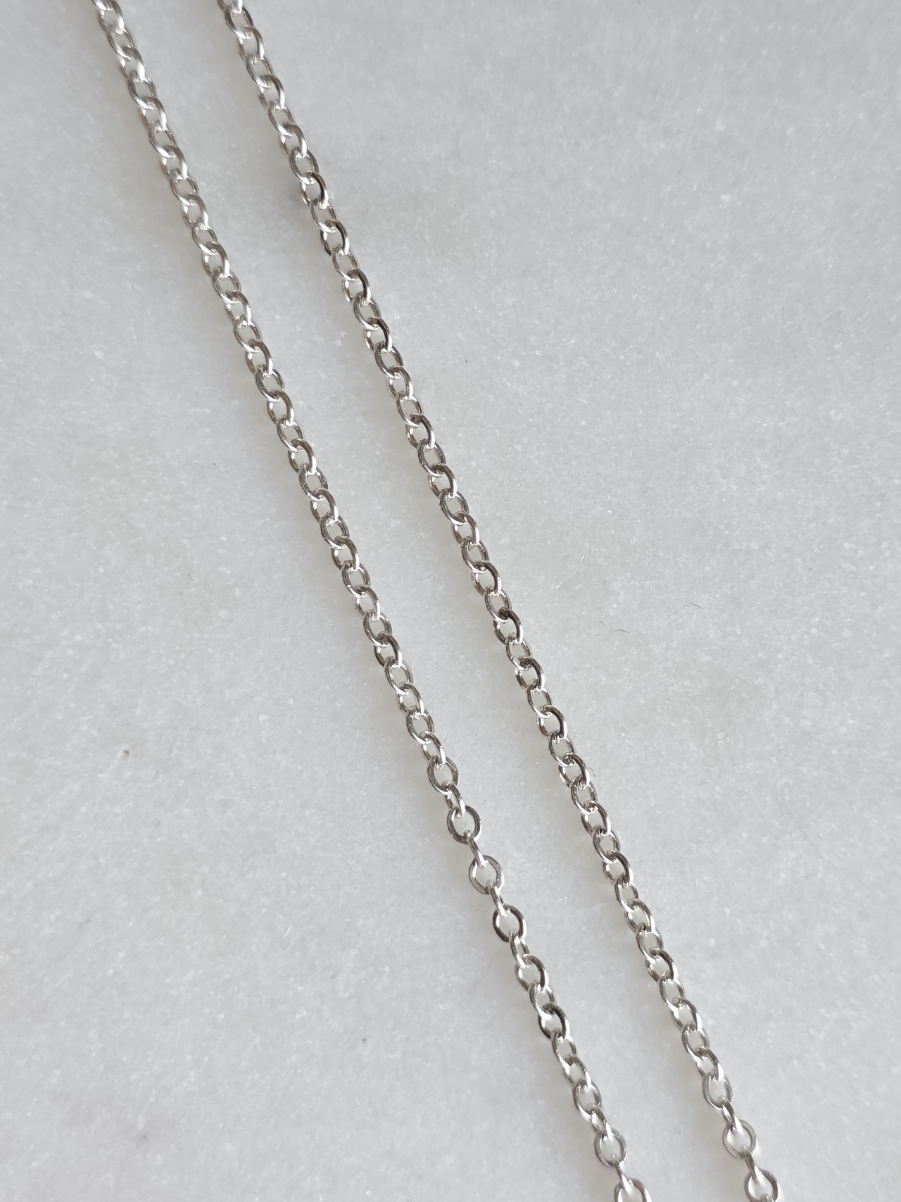 Dije de Huellita Mini con topacio azul
